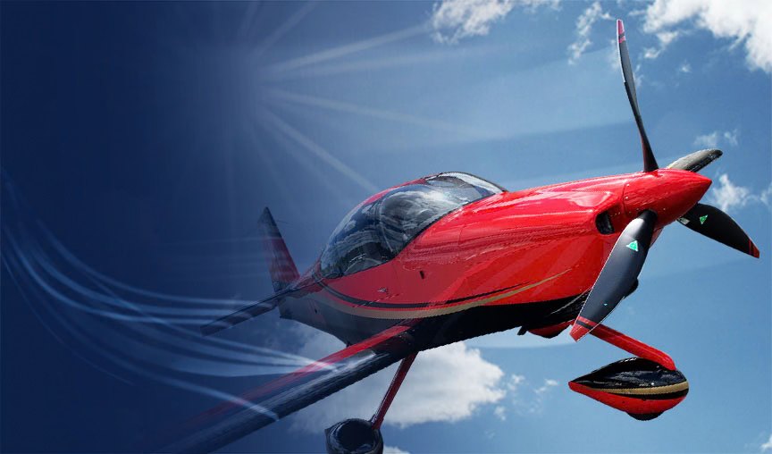 Red aerobatic aircraft banking against a blue sky with a black MT propeller