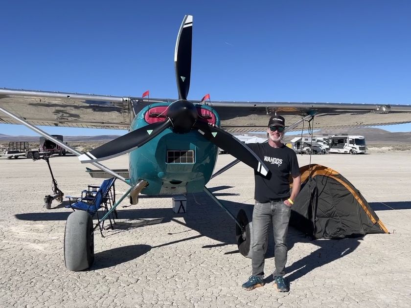 Teal Cessna 185 with its owner and a three-blade MT propeller