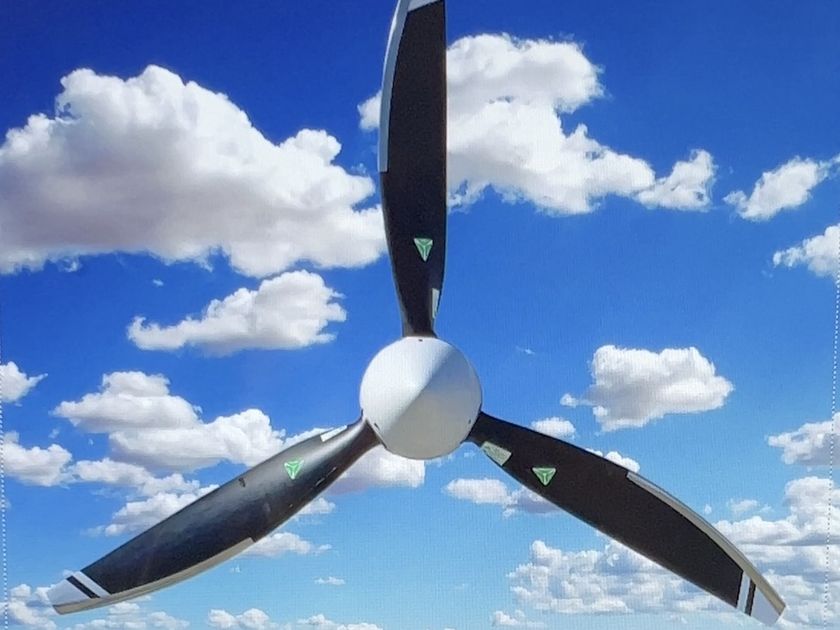 Three-blade MT composite propeller against a blue sky